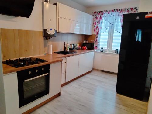 Kuchyňa alebo kuchynka v ubytovaní Apartament Radość