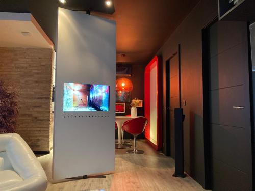 a living room with a couch and a table at Zrooms&Suites Hostel Boutique in Zaragoza
