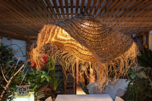a large chandelier hanging from a ceiling at Zrooms&Suites Hostel Boutique in Zaragoza