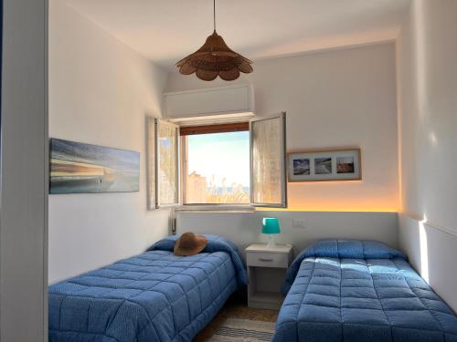 Ένα ή περισσότερα κρεβάτια σε δωμάτιο στο Sabbia Dorata