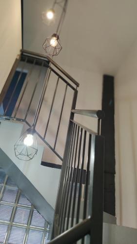 a metal staircase with two lights on top of it at valencialoft in Valencia