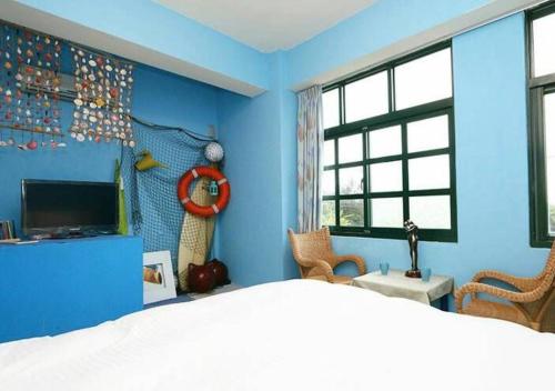 TV a/nebo společenská místnost v ubytování Wushih Surf Hostel
