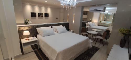 Un pat sau paturi într-o cameră la Vó Ita Hotel