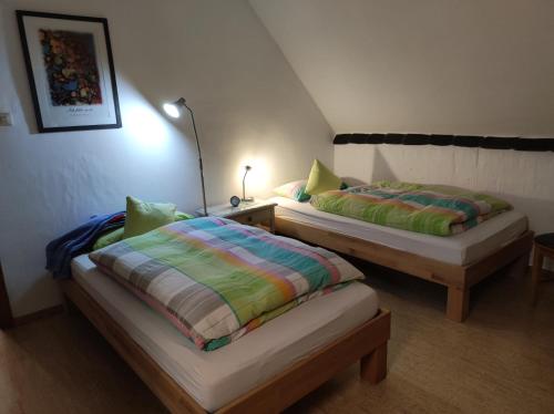 two beds sitting next to each other in a room at Urlaub am Auberg in Gerolstein