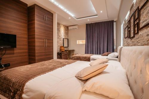 Säng eller sängar i ett rum på MAGICO Rooms & Apartments