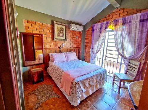 Tempat tidur dalam kamar di Casa Rústica