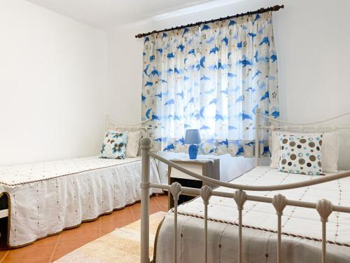 a bedroom with two beds and a window at House in Vila Nova de Cerveira with Pool and BBQ #1881 in Campos