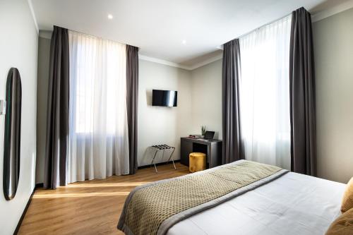 Ένα ή περισσότερα κρεβάτια σε δωμάτιο στο The Cross Hotel
