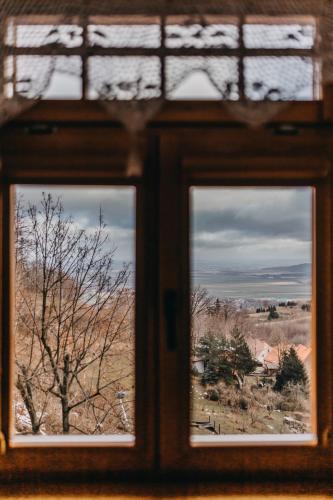 a window with three views of a field at Villa Hubertus in Srebrna Góra