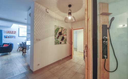 a hallway with a shower in a room at Maison Des Praz Chamonix in Chamonix-Mont-Blanc