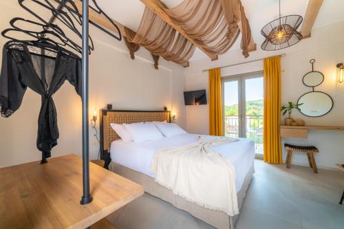 a bedroom with a bed in a room at Perla Luxury Living in Parga