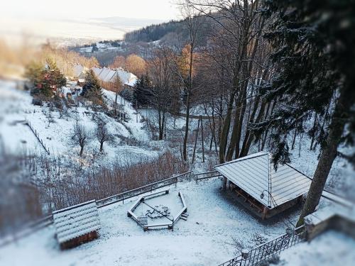 an aerial view of a house with snow on the ground at Villa Hubertus in Srebrna Góra