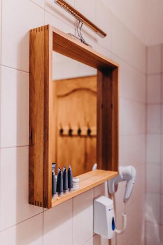 a bathroom with a mirror and a sink at Villa Hubertus in Srebrna Góra