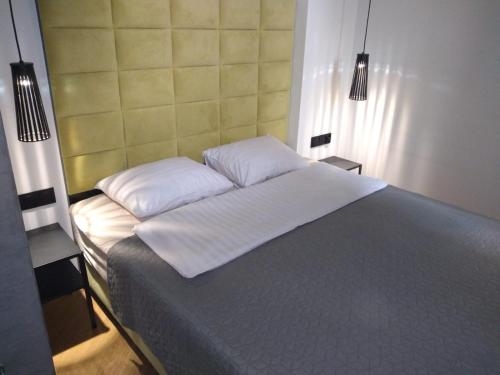 A bed or beds in a room at Dodo Acomodo 5