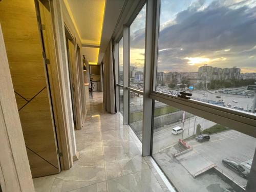 a room with a large window and a view of a city at Le Luxe Suites Hotel & Spa in Bursa