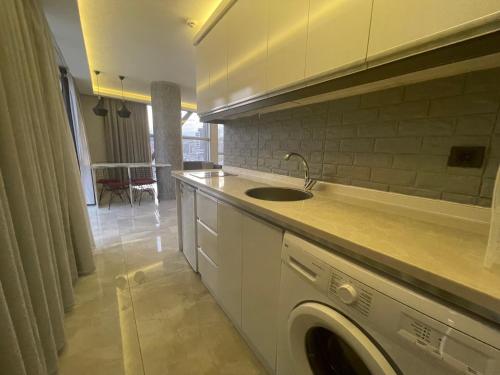 A kitchen or kitchenette at Le Luxe Suites Hotel & Spa