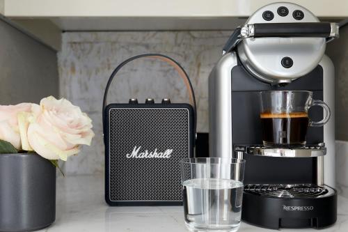 a kitchen counter with a coffee maker and a blender at My Santorini Villa, Pyrgos Luxury in Pirgos