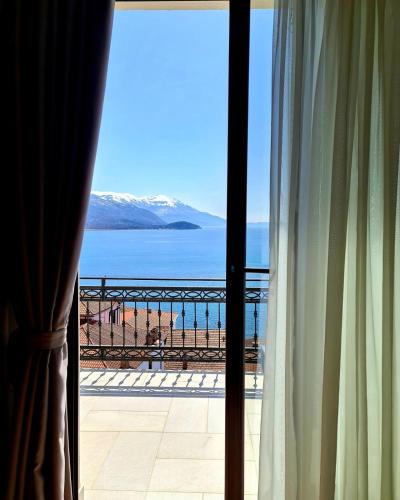 a view of the beach from a hotel room window at PS Apartments in Ohrid