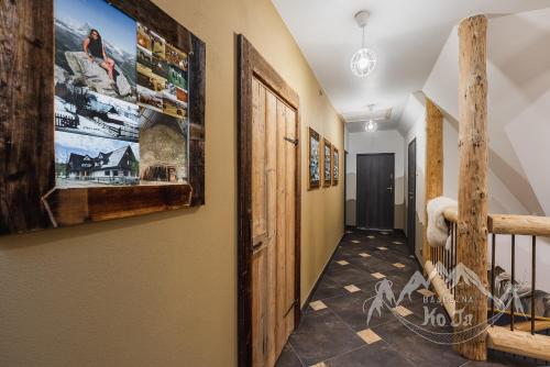 a hallway in a house with a staircase at Bajeczna KoJa in Witów
