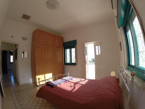 Postel nebo postele na pokoji v ubytování Auberg-Inn Guesthouse