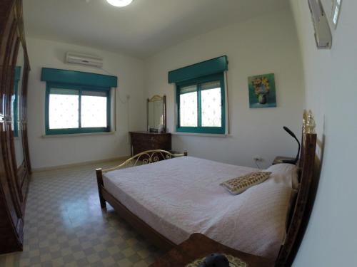 Postel nebo postele na pokoji v ubytování Auberg-Inn Guesthouse