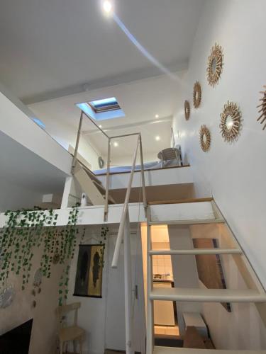 a staircase in a house with a stair case at Grand studio Ermont in Ermont