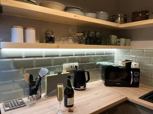 a kitchen with a counter top with a microwave at Над фермою in Nizhne-Studënyy