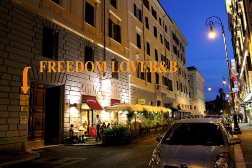 a building with a sign that reads freedom lyonvelt at Freedom Love B&B in Rome