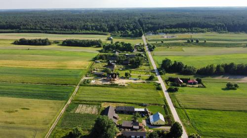 an aerial view of a farm in the countryside at Siedlisko na Wzgórzu - Noclegi Agroturystyka - Borsuki in Sarnaki