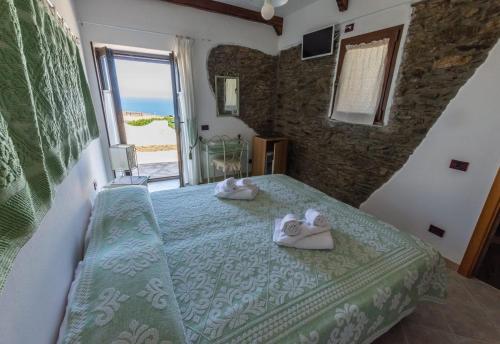 Кровать или кровати в номере Agriturismo Finagliosu