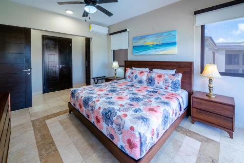 a bedroom with a bed and a dresser and a window at Penthouse Reef 401 - Beautiful Beachfront Ocean View - at El Faro in Playa del Carmen