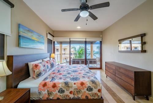 a bedroom with a bed and a ceiling fan at Penthouse Reef 401 - Beautiful Beachfront Ocean View - at El Faro in Playa del Carmen