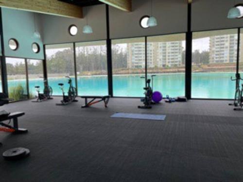 a large gym with a swimming pool in a building at Departamento Playa Las Cruces LagunaMar 3D2B con KYAK in Las Cruces