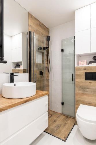 a bathroom with a sink and a shower at Rysy in Zakopane