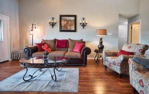 a living room with a couch and a coffee table at Home On the Green in Salado