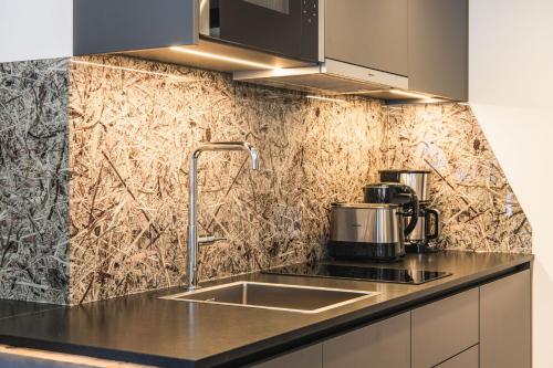 Una cocina o kitchenette en Hotel Wolf