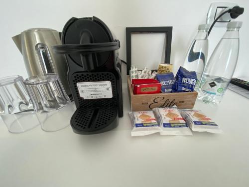 a coffee maker sitting on top of a counter at Mapi’s Rooms in Cagliari