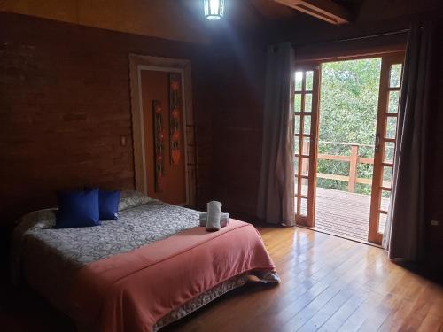 Llit o llits en una habitació de Cabanas Mountain