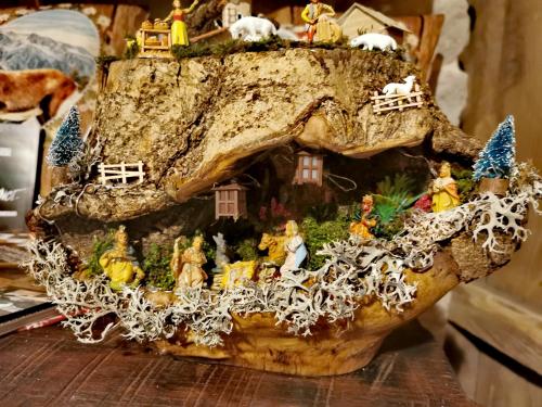 a group of figurines in a tree stump at Baita Relais La Cesarina in Vico Canavese