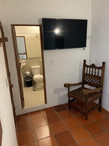 A television and/or entertainment centre at Hostal Home Sant Angelo
