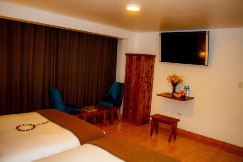 TV a/nebo společenská místnost v ubytování Hotel Tara Machupicchu