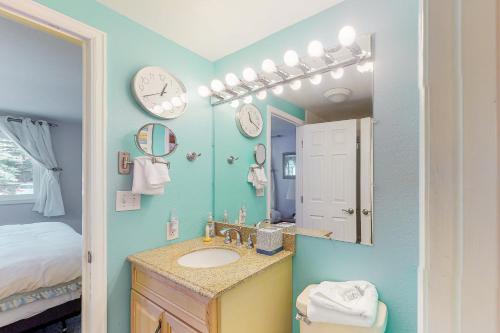 a bathroom with a sink and a mirror at Alpine Privacy in Breckenridge