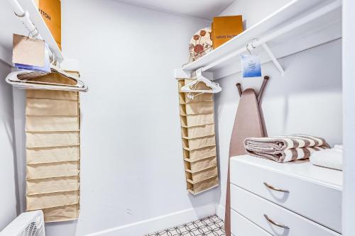 a walk in closet with a dresser and towels at PD Retreat Permit# STR2022-0253 in Palm Desert