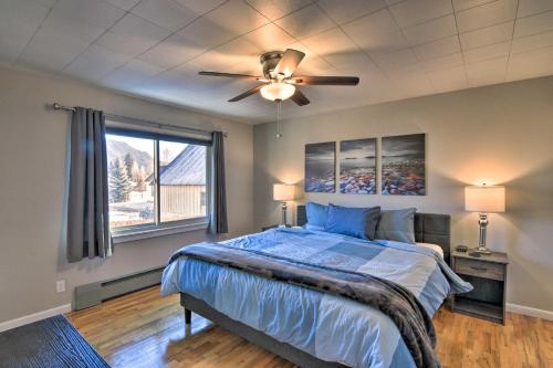a bedroom with a bed and a ceiling fan at Downtown Buena Vista Cabin with Patio and Grill! in Buena Vista