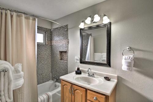 a bathroom with a sink and a shower and a mirror at Downtown Buena Vista Cabin with Patio and Grill! in Buena Vista