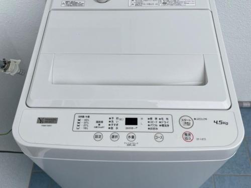 a close up of a white washing machine at Villa Sunbeams ヴィラ・サンビームス in Kin