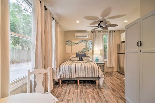 a bedroom with a bed and a ceiling fan at Ozona Studio with Shared Deck - Steps to Gulf! in Palm Harbor