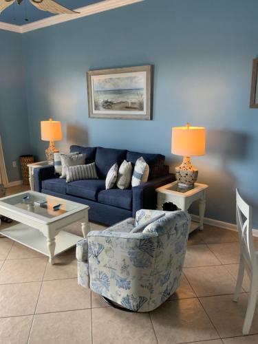 a living room with a couch and a table at VacayFun Condos-Phoenix VII 004 in Orange Beach