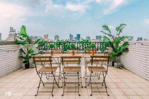 a table and chairs on the roof of a building at Tainan Haian Art Apartment in Tainan