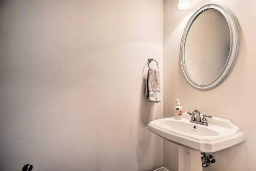 a bathroom with a sink and a mirror at Upscale Home with Poker Room Less Than 1 Mi to Golf! in Aiken